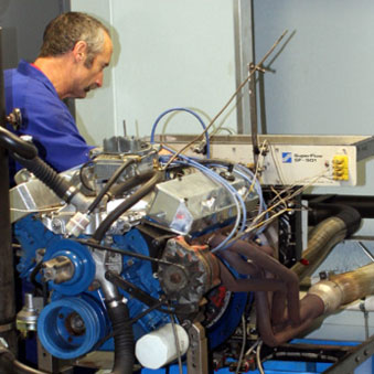 Grant Rivers tuning a V8 race engine on the dyno